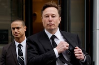 FILE PHOTO: Tesla CEO Elon Musk and his security detail depart the company?s local office in Washington, U.S. January 27, 2023.  REUTERS/Jonathan Ernst/File Photo