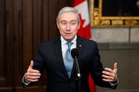 François-Philippe Champagne, Minister of Innovation, Science and Industry of Canada, speaks to reporters in the foyer of the House of Commons before Question Period on Parliament Hill in Ottawa, on Friday, Nov. 24, 2023. THE CANADIAN PRESS/Spencer Colby