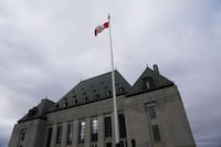 The Northwest Territories education minister erred in refusing to allow students from five families to attend a French school, the Supreme Court of Canada said Friday. The flag of the Supreme Court of Canada flies on the east flag pole in Ottawa, on Monday, Nov. 28, 2022.THE CANADIAN PRESS/Sean Kilpatrick
