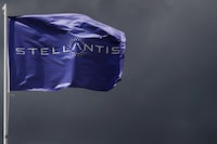 A flag with the logo of Stellantis is seen at the company's corporate office building in Saint-Quentin-en-Yvelines near Paris, France, May 5, 2021. REUTERS/Gonzalo Fuentes/File Photo