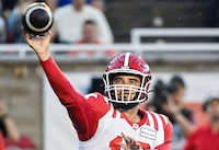 Calgary Stampeders quarterback Jake Maier (12) throws a pass during first half CFL football action against the Montreal Alouettes in Montreal, Sunday, July 30, 2023. THE CANADIAN PRESS/Graham Hughes