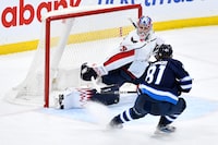 Winnipeg Jets' Kyle Connor (81) scores on Washington Capitals goaltender Charlie Lindgren (79) during the third period of NHL action in Winnipeg on Monday March 11, 2024. THE CANADIAN PRESS/Fred Greenslade