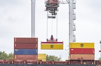 Between mid-December and the end of March, police inspected about 400 shipping containers at the Port of Montreal and found nearly 600 stolen vehicles, most of them from the Toronto area.
A shipping container is loaded onto a container ship in the Port of Montreal on Tuesday, Sept.19, 2023. THE CANADIAN PRESS/Christinne Muschi