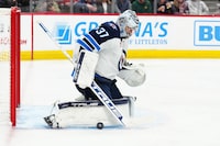 Dec 7, 2023; Denver, Colorado, USA; Winnipeg Jets goaltender Connor Hellebuyck (37) makes a save in the second period against the Colorado Avalanche at Ball Arena. Mandatory Credit: Ron Chenoy-USA TODAY Sports