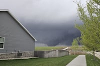 A tornado moves through suburbs northwest of Omaha on Friday, April 26, 2024, as seen from Bennington, Neb. (Chris Gannon via AP)