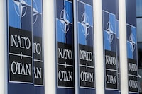 FILE PHOTO: NATO logos are seen at the Alliance headquarters ahead of a NATO Defence Ministers meeting, in Brussels, Belgium, October 21, 2021. REUTERS/Pascal Rossignol/File Photo