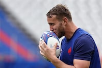 France's flanker Anthony Jelonch kisses the ball during a training session at the Stade de France, in Saint-Denis, on October 13, 2023, during the France 2023 Rugby World Cup. (Photo by Anne-Christine POUJOULAT / AFP) (Photo by ANNE-CHRISTINE POUJOULAT/AFP via Getty Images)
