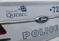 <div>Eight people were lucky to escape without serious injuries when a crowded balcony in Quebec City went crashing to the ground early&nbsp; Sunday morning. A Quebec City police car is seen in Quebec City, Friday, Dec. 3, 2021. THE CANADIAN PRESS/Jacques Boissinot</div>