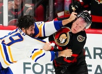 Ottawa Senators left wing Brady Tkachuk (right) and Buffalo Sabres right wing Alex Tuch (89) fight during third period NHL hockey action in Ottawa on Tuesday, Oct. 24, 2023.THE CANADIAN PRESS/Sean Kilpatrick
