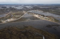 Peguis First Nation is shown surrounded with Fisher River flood water north of Winnipeg, Sunday, May 15, 2022. A Manitoba First Nation has declared a state of emergency in response to a health crisis caused by repeated flooding. THE CANADIAN PRESS/John Woods