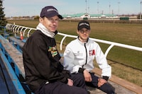 Jockey David Moran (left) sits with his son, apprentice jockey Pietro Moran, at Woodbine Racetrack in Toronto on Wednesday, April 10, 2024. THE CANADIAN PRESS/Chris Young