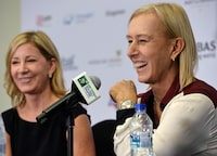(FILES) Four-time WTA Finals singles champion Chris Evert (L) and eight-time WTA Finals singles champion Martina Navratilova (R) attend a joint press conference during the WTA finals tennis tournament on October 29, 2016 in Singapore. American tennis legends Chris Evert and Martina Navratilova criticized Saudi Arabian money flowing into women's tennis on January 25, 2024 in an opinion article published in the Washington Post. (Photo by ROSLAN RAHMAN / AFP) (Photo by ROSLAN RAHMAN/AFP via Getty Images)