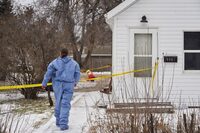 Forensic investigators on the scene of an ongoing investigation regarding five deaths in southern Manitoba, in Carman, Man., Monday, Feb. 12, 2024.&nbsp;People in Carman, Manitoba are scheduled to gather today for the funeral of five people killed in what RCMP have called an unimaginable tragedy.&nbsp;THE CANADIAN PRESS/David Lipnowski
