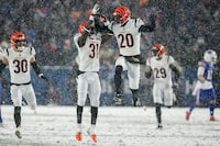 Cincinnati Bengals safety Michael Thomas (31) and Cincinnati Bengals cornerback Eli Apple (20) react after a defensive play against the Buffalo Bills during the fourth quarter of an NFL division round football game, Sunday, Jan. 22, 2023, in Orchard Park, N.Y. (AP Photo/Seth Wenig)