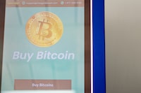 PFLUGERVILLE, TEXAS - APRIL 19: A Bitcoin ATM in an ACE Cash Express check cashing and loaning service center on April 19, 2024 in Pflugerville, Texas. Bitcoin cryptocurrency is halving, a process in which bitcoin undergoes a change in its base blockchain technology designed to moderate the rate at which new bitcoins are generated. The halving occurs roughly every four years.  (Photo by Brandon Bell/Getty Images)
