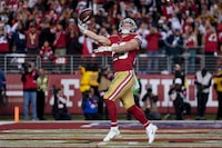 San Francisco 49ers running back Christian McCaffrey celebrates after scoring against the Dallas Cowboys during the second half of an NFL divisional playoff football game in Santa Clara, Calif., Sunday, Jan. 22, 2023. (AP Photo/Godofredo A. Vásquez)