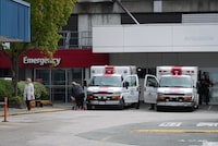 Paramedics and ambulances are seen outside the emergency department at Burnaby Hospital in Burnaby, B.C., on Monday, May 30, 2022. COVID-19 cases are continuing to rise in British Columbia, with the BC Centre for Disease Control reporting hospitalizations are up nearly 60 per cent in the past two weeks. THE CANADIAN PRESS/Darryl Dyck