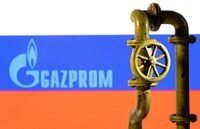 FILE PHOTO: A 3D printed natural gas pipeline is placed in front of displayed Gazprom logo and Russian flag in this illustration taken February 8, 2022. REUTERS/Dado Ruvic/Illustration/File Photo