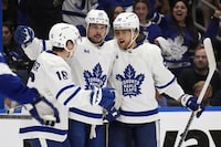 Toronto Maple Leafs center Auston Matthews (34) celebrates his goal against the Tampa Bay Lightning with right wing William Nylander (88) and right wing Mitchell Marner (16) during the third period in Game 4 of an NHL hockey Stanley Cup first-round playoff series Monday, April 24, 2023, in Tampa, Fla. (AP Photo/Chris O'Meara)