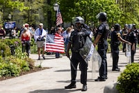 University of Chicago police keep watch as pro-Palestinians protesters and counter-protesters rally at the encampment in the quad at the University of Chicago on the South Side, Friday, May 3, 2024. (Ashlee Rezin/Chicago Sun-Times via AP)