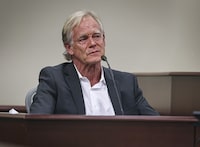 A teary-eyed David Halls, former first assistant director on "Rust," takes a moment to collect himself after recounting the moments following the fatal shooting of cinematographer Halyna Hutchins during a 2021 rehearsal, while testifying during Hannah Gutierrez-Reed's involuntary manslaughter trial in state district court in Santa Fe, N.M., Thursday, Feb. 29, 2024. (Gabriela Campos/Santa Fe New Mexican via AP, Pool)