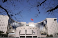 FILE PHOTO: The headquarters of the People's Bank of China, the central bank, is pictured in Beijing, China, February 3, 2020. REUTERS/Jason Lee/File Photo