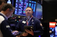 Traders work on the floor at the New York Stock Exchange (NYSE) in New York City, U.S., December 4, 2023.  REUTERS/Brendan McDermid