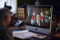 Britain's King Charles III speaks to Canadian Prime Minister Justin Trudeau via videolink during a virtual audience, at Buckingham Palace, in London, Wednesday, March 6, 2024. THE CANADIAN PRESS/Victoria Jones/Pool photo via AP