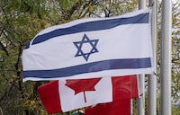 The City of Ottawa has cancelled the ceremony surrounding the raising of Israel's flag at city hall due to security concerns. Canadian and Israeli flags fly in Ottawa on Wednesday, October 11, 2023. THE CANADIAN PRESS/Adrian Wyld