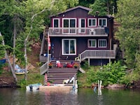 Cottage with stairs leading to the water