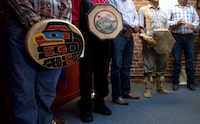 First Nations chiefs hold drums while listening during a news conference in Vancouver, B.C., after the Supreme Court of Canada ruled in favour of the Tsilhqot'in First Nation, granting it land title to 438,000-hectares of land on Thursday June 26, 2014. THE CANADIAN PRESS/Darryl Dyck