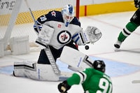 Apr 11, 2024; Dallas, Texas, USA; Winnipeg Jets goaltender Laurent Brossoit (39) stops a shot by Dallas Stars center Tyler Seguin (91) during the third period at the American Airlines Center. Mandatory Credit: Jerome Miron-USA TODAY Sports