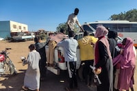 Displaced people fleeing from Wad Madani in Sudan's Jazira state arrive in Gedaref in the country's east on December 18, 2023. Paramilitary forces established a base on December 17, 2023 in the formerly safe city of Wad Madani in war-torn Sudan, an AFP correspondent reported, sending thousands fleeing, many of them already displaced. (Photo by AFP) (Photo by -/AFP via Getty Images)