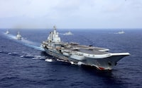 FILE PHOTO: China's aircraft carrier Liaoning takes part in a military drill of Chinese People's Liberation Army (PLA) Navy in the western Pacific Ocean, April 18, 2018. Picture taken April 18, 2018. REUTERS/Stringer