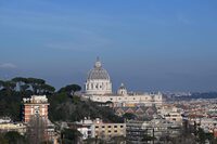 A photo shows the dome of St Peter's Basilica in the Vatican, as seen from Rome, during the lying in state of Pope Emeritus Benedict XVI, on January 4, 2023. - Benedict, a conservative intellectual who in 2013 became the first pontiff in six centuries to resign, died on December 31, 2022, at the age of 95. Thousands of Catholics began paying their respects on January 2, 2023 to former pope Benedict XVI at St Peter's Basilica at the Vatican, at the start of three days of lying-in-state before his funeral. (Photo by Andreas SOLARO / AFP) (Photo by ANDREAS SOLARO/AFP via Getty Images)