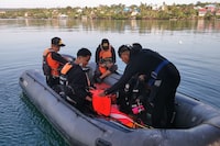 This handout photo from Indonesia's National Rescue Agency (Basarnas) taken and released on July 24, 2023 shows members of a rescue team setting out to conduct search and rescue operations in Buton Tengah, southwest Sulawesi after a ferry sank. At least 15 people were killed and 19 more were missing on July 24 after a ferry sank off the coast of Indonesia's Sulawesi island, search and rescue officials said. (Photo by Handout / BASARNAS / AFP) / -----EDITORS NOTE --- RESTRICTED TO EDITORIAL USE - MANDATORY CREDIT "AFP PHOTO / INDONESIA'S NATIONAL RESCUE AGENCY (BASARNAS) " - NO MARKETING - NO ADVERTISING CAMPAIGNS - DISTRIBUTED AS A SERVICE TO CLIENTS (Photo by HANDOUT/BASARNAS/AFP via Getty Images)