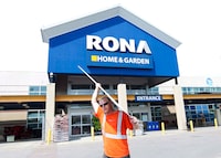 RONA Inc. says it's eliminating 500 jobs across Canada in a bid to simplify its organizational structure. A man carries building supplies from a RONA store in Toronto on July 31, 2012. THE CANADIAN PRESS/Nathan Denette