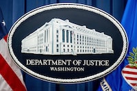 A former Montreal resident has been sentenced to 10 years in a United States federal prison for a multi-decade fraud that convinced more than a million Americans to send money to fake psychics. A U.S. Department of Justice sign is seen, Nov. 18, 2022, in Washington. THE CANADIAN PRESS/AP-Andrew Harkin