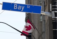 The Bay Street Financial District is shown with the Canadian flag in Toronto on Friday, August 5, 2022.&nbsp;Brookfield Asset Management Ltd. says it has raised US$12 billion for its latest global private equity fund. THE CANADIAN PRESS/Nathan Denette