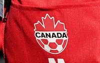 Ontario has conditionally committed to giving Toronto up to $97 million for the city's FIFA World Cup hosting duties. Toronto is set to host three games in the 2026 World Cup that will also see games in Vancouver in addition to games in both the U.S. and Mexico. A detail view of Canada branding on the team uniform during a training session ahead of the FIFA Women's World Cup in Melbourne, Australia, Monday, July 17, 2023. THE CANADIAN PRESS/Scott Barbour