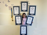 Mamathi Vinoth, 9, is shown with her Guinness world records in an undated handout photo. Vinoth practised hula hooping almost every day after school until bedtime before she spun and hopped her way through three Guinness World Records. THE CANADIAN PRESS/HO-Kadambari Vinoth, *MANDATORY CREDIT*