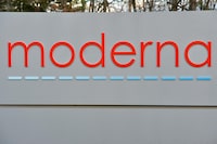 (FILES) In this file photo the Moderna logo is seen at the Moderna campus in Norwood, Massachusetts on on December 2, 2020, where the biotechnology company is mass producing its Covid-19 vaccine. - US biotech firm Moderna said on July 7, 2021 it had dosed its first participants in a human study of an mRNA vaccine that targets multiple strains of influenza. The company intends to recruit 180 adults in the United States for the Phase 1/2 portion of the trial to evaluate the safety and strength of immune response to the shot, called mRNA-1010. (Photo by Joseph Prezioso / AFP) (Photo by JOSEPH PREZIOSO/AFP via Getty Images)