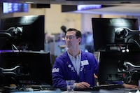 A trader works on the trading floor at the New York Stock Exchange (NYSE) in New York City, U.S., April 5.