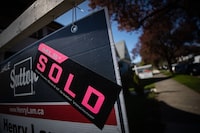 A sold sticker is seen on a for sale sign outside a house that was sold in east Vancouver, on Wednesday, April 15, 2020. Darryl Dyck/The Globe and Mail