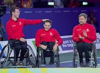 Canada's Colin Higgins, Vincent Dallaire and Robert Hedges, left to right, wait for their silver medals in 3 x 3 men's wheelchair basketball  at the Commonwealth Games in Birmingham, England on Tuesday, Aug. 2, 2022. Australia defeated Canada 11-9 to win gold. THE CANADIAN PRESS/Andrew Vaughan