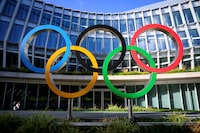 FILE PHOTO: Olympic Rings are pictured in front of The Olympic House, headquarters of the International Olympic Committee (IOC) at the opening of the executive board meeting of the International Olympic Committee (IOC), in Lausanne, Switzerland September 8, 2022.Laurent Gillieron/Pool via REUTERS