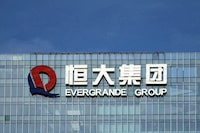 FILE PHOTO: China Evergrande Group's logo is seen on its headquarters in Shenzhen, Guangdong province, China, Sept. 26, 2021. REUTERS/Aly Song/File Photo