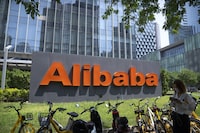 FILE - The logo of Chinese technology firm Alibaba is seen at its office in Beijing on Aug. 10, 2021. China's Alibaba Group says its CEO Eddie Wu will head its core e-commerce business, as the company seeks to drive growth and fend off fast-growing online shopping rivals like Pinduoduo. (AP Photo/Mark Schiefelbein, File)
