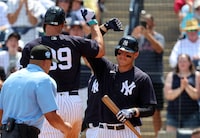 Mar 26, 2023; Tampa, Florida, USA; New York Yankees center fielder Aaron Judge (99) is congratulated by first baseman Anthony Rizzo (48) after he hit a 2 run home run against the Toronto Blue Jays during the fifth inning  at George M. Steinbrenner Field. Mandatory Credit: Kim Klement-USA TODAY Sports