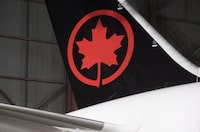 The Air Canada logo is shown on a plane at a hangar at the Toronto Pearson International Airport in Mississauga, Ont., on February 9, 2017. THE CANADIAN PRESS/Mark Blinch